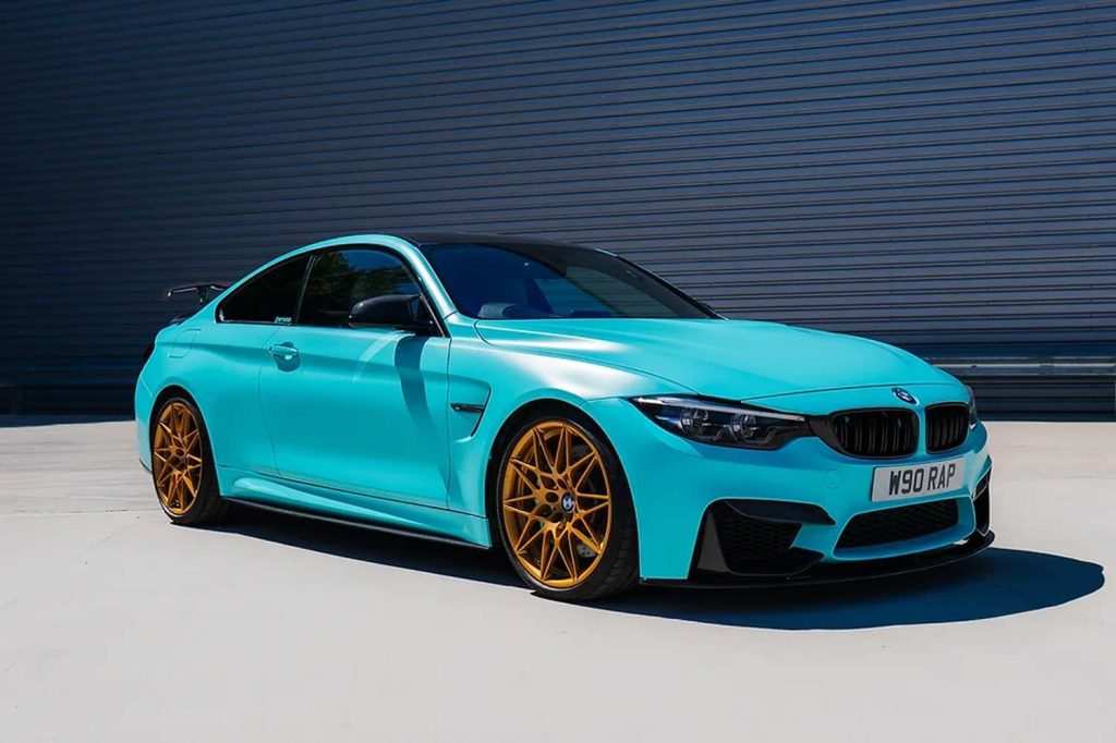 Blue BMW M4 outside garage