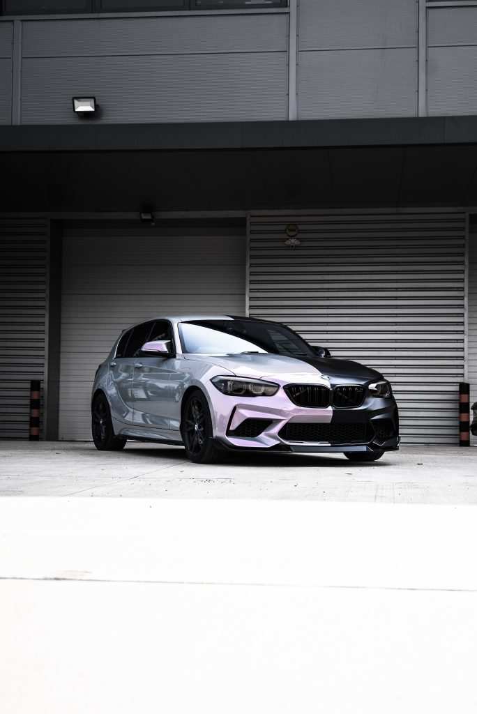 bmw m3 parked outside garage