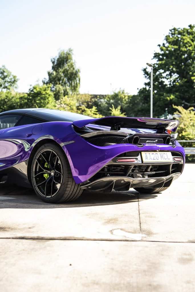 Side profile of McLaren in purple wrap