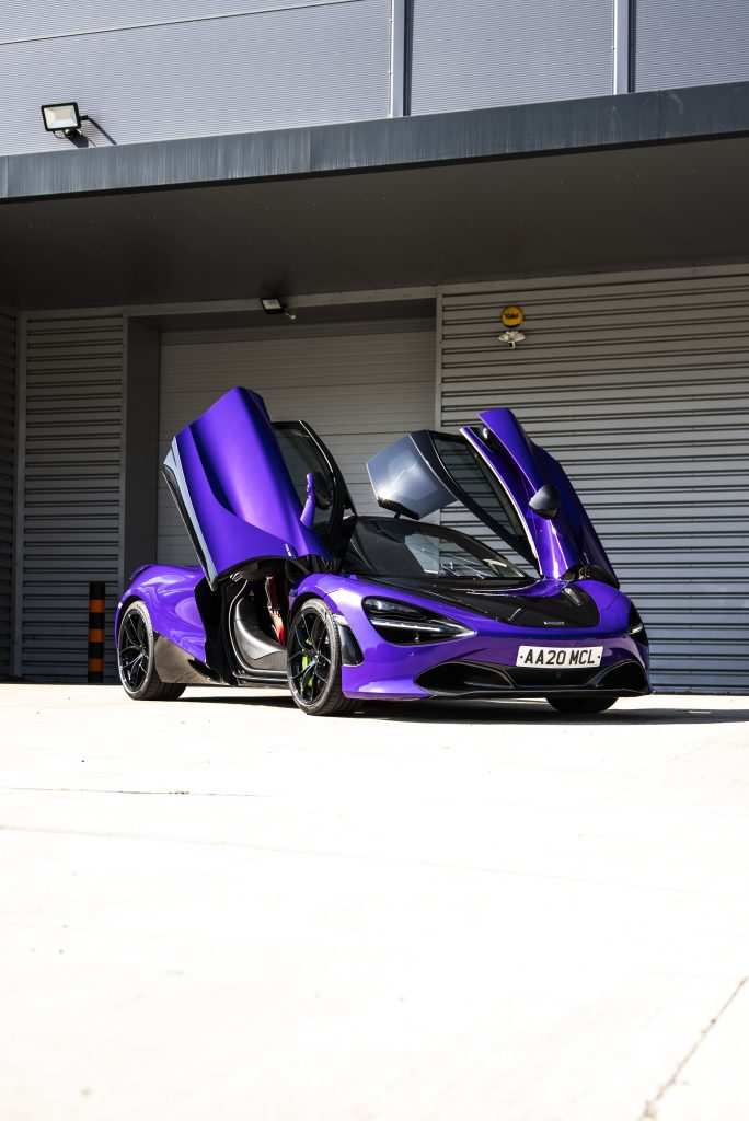 Supercar wrapped in Gloss Plum Explosion vinyl