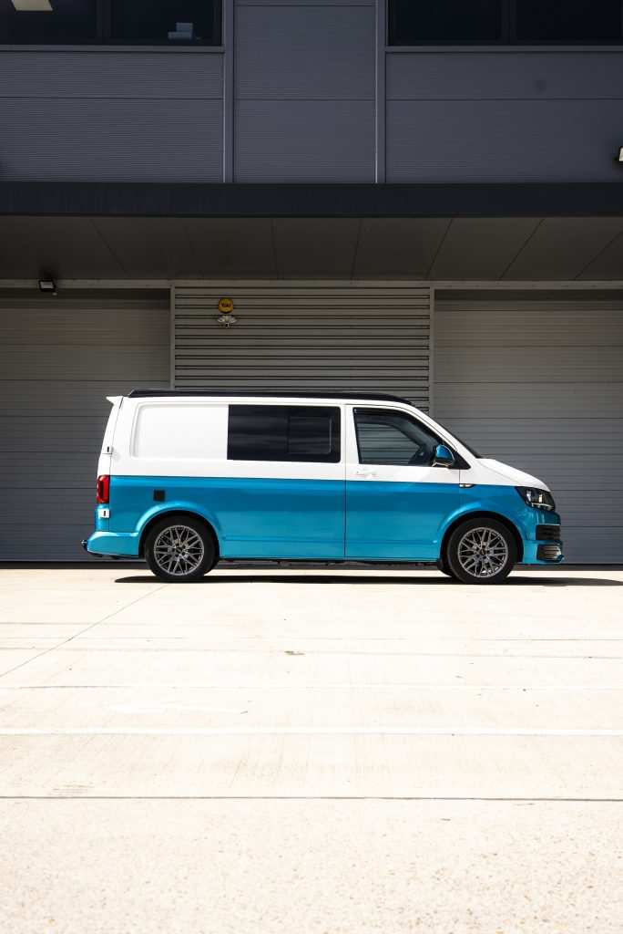 Side profile of VW T6 with atomic teal half wrap