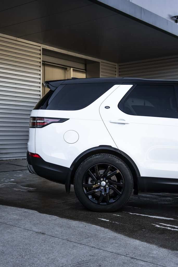 Luxury SUV wrapped in gloss white vinyl