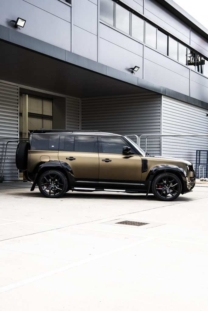 Land Rover Defender wrapped in matte gold with Urban styling kit