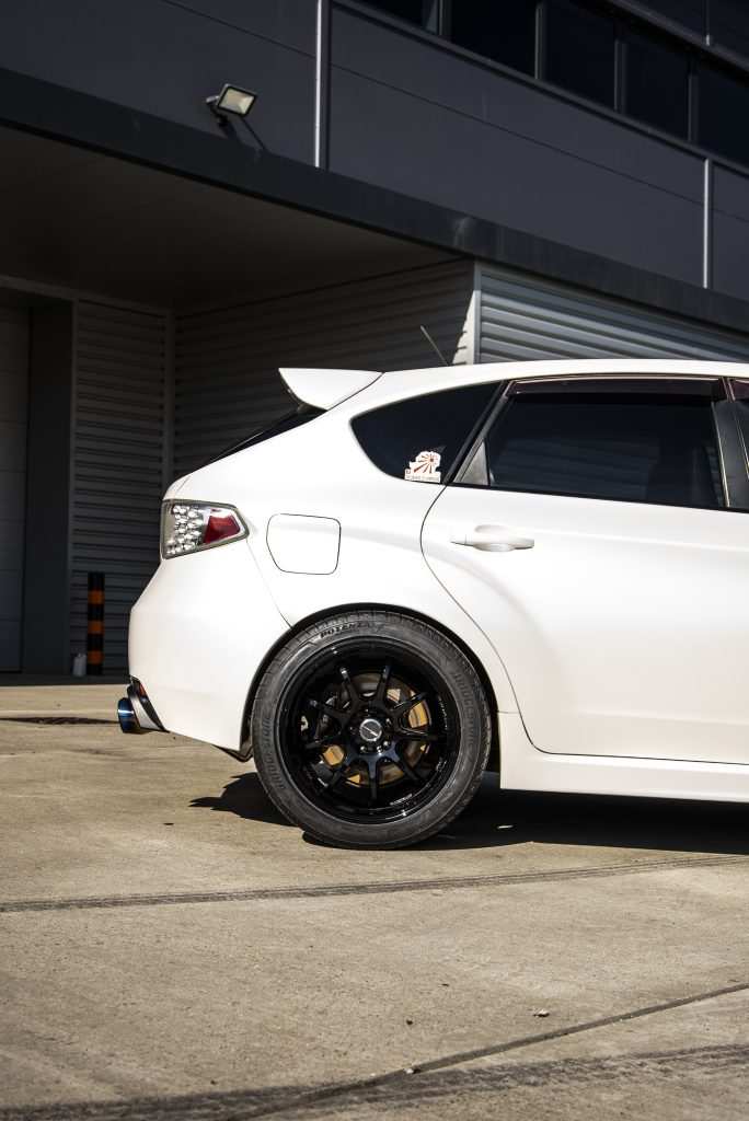 Side profile of Subaru in satin pearl white